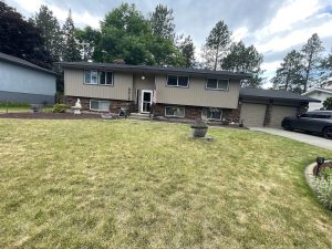Finished exterior of a Spokane-area home with new siding, trim and gutters by All Things Remodel